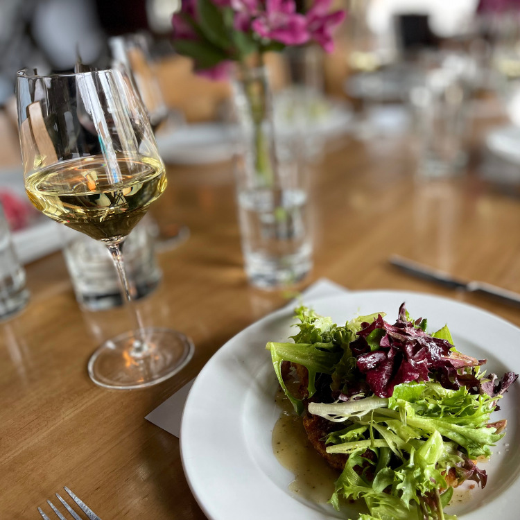 salad and wine on a table at carte blanche